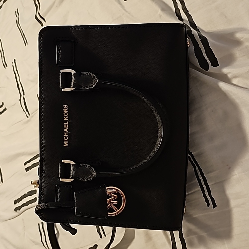 Small, black Michael Kors bag in Great Condition like New !